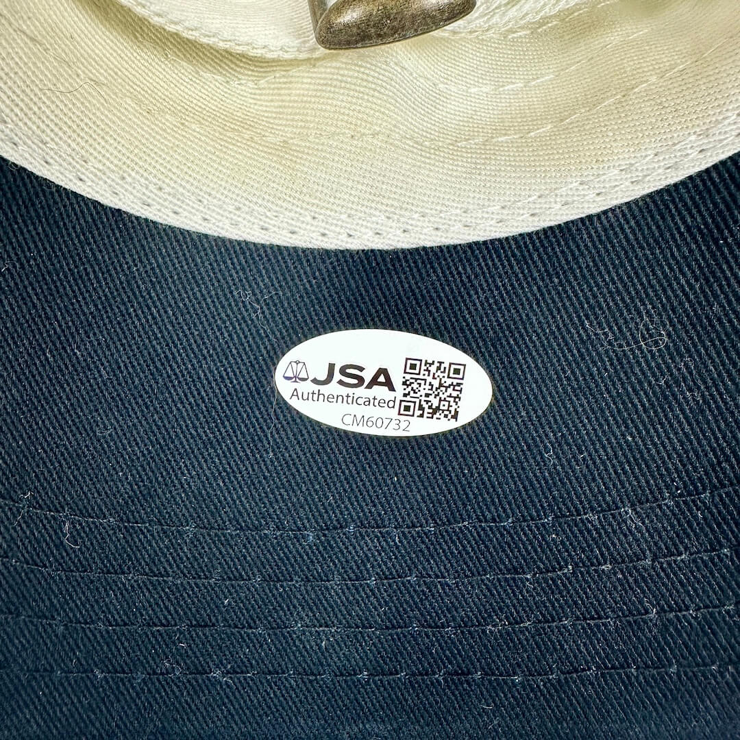 Black hat brim with a JSA authentication label. 