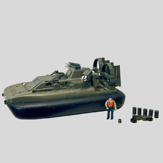 Toy hovercraft with a figure and accessories on a white background