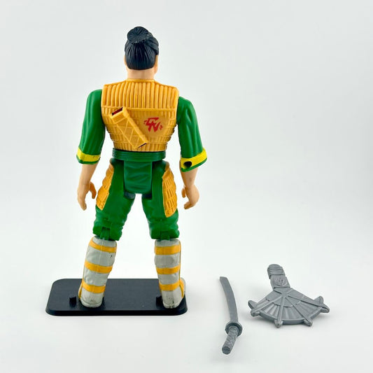 Toy figure with green and yellow outfit on a white background