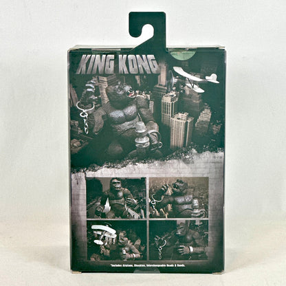 King Kong action figure packaging with cityscape background