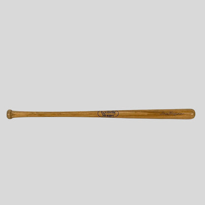 Wooden baseball bat with branding on a white background