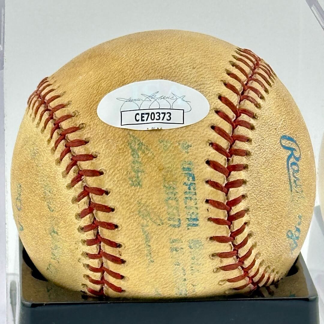 Close up of JSA authentication sticker next to MLB ball information stamp.