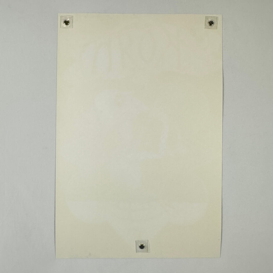 Backside of white poster showing no damage to edges, corners or face. 