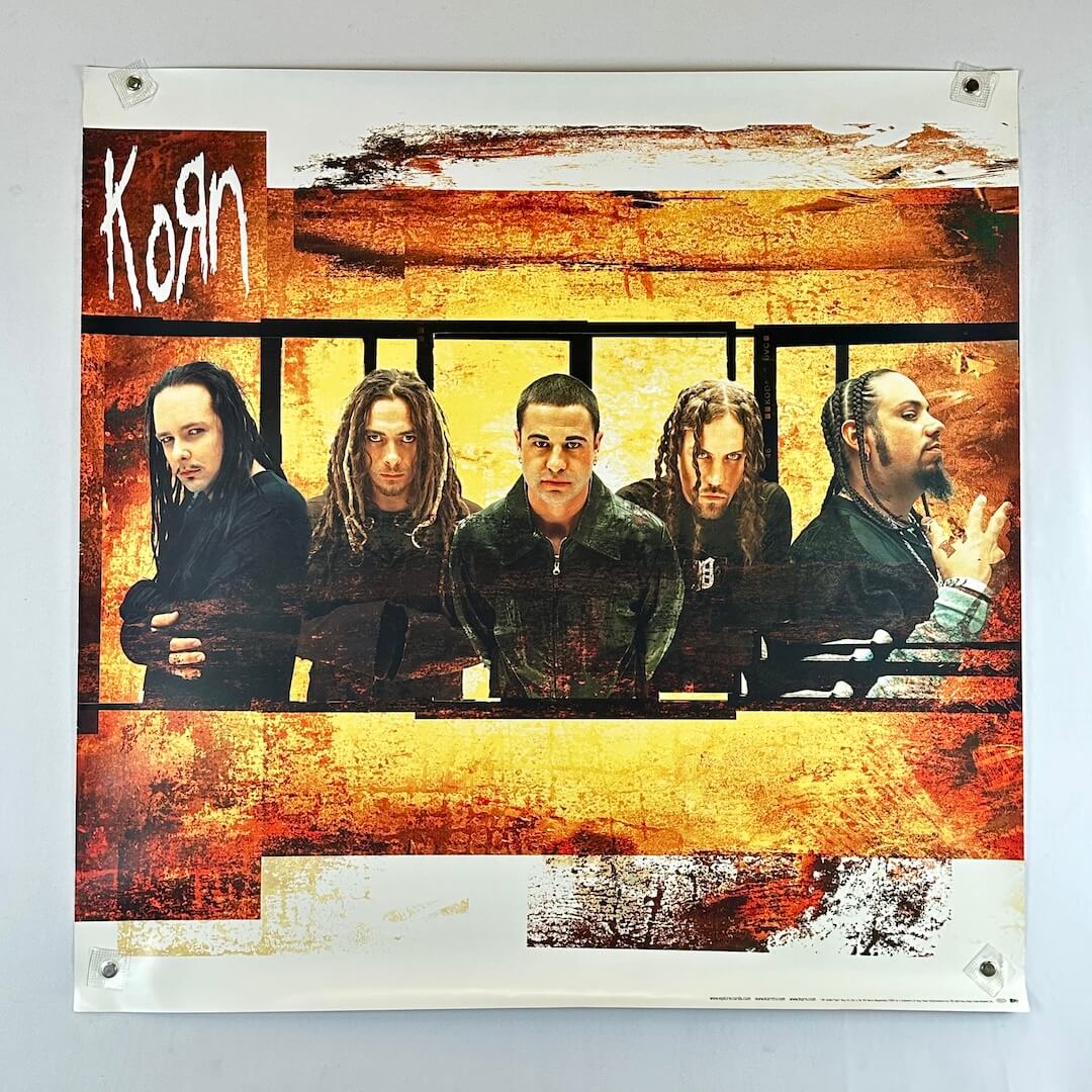 Poster of a band with a textured orange and brown background