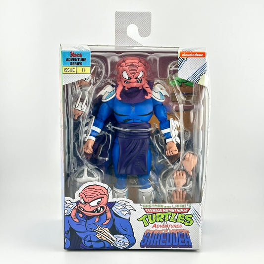 Action figure in packaging with 'Teenage Mutant Ninja Turtles' branding on a white background