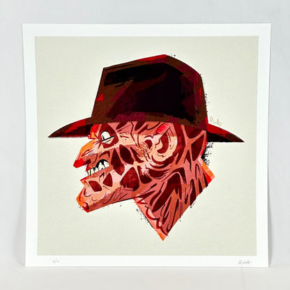 A square art print featuring a stylized illustration of Freddy Krueger in profile, wearing a dark fedora hat. 