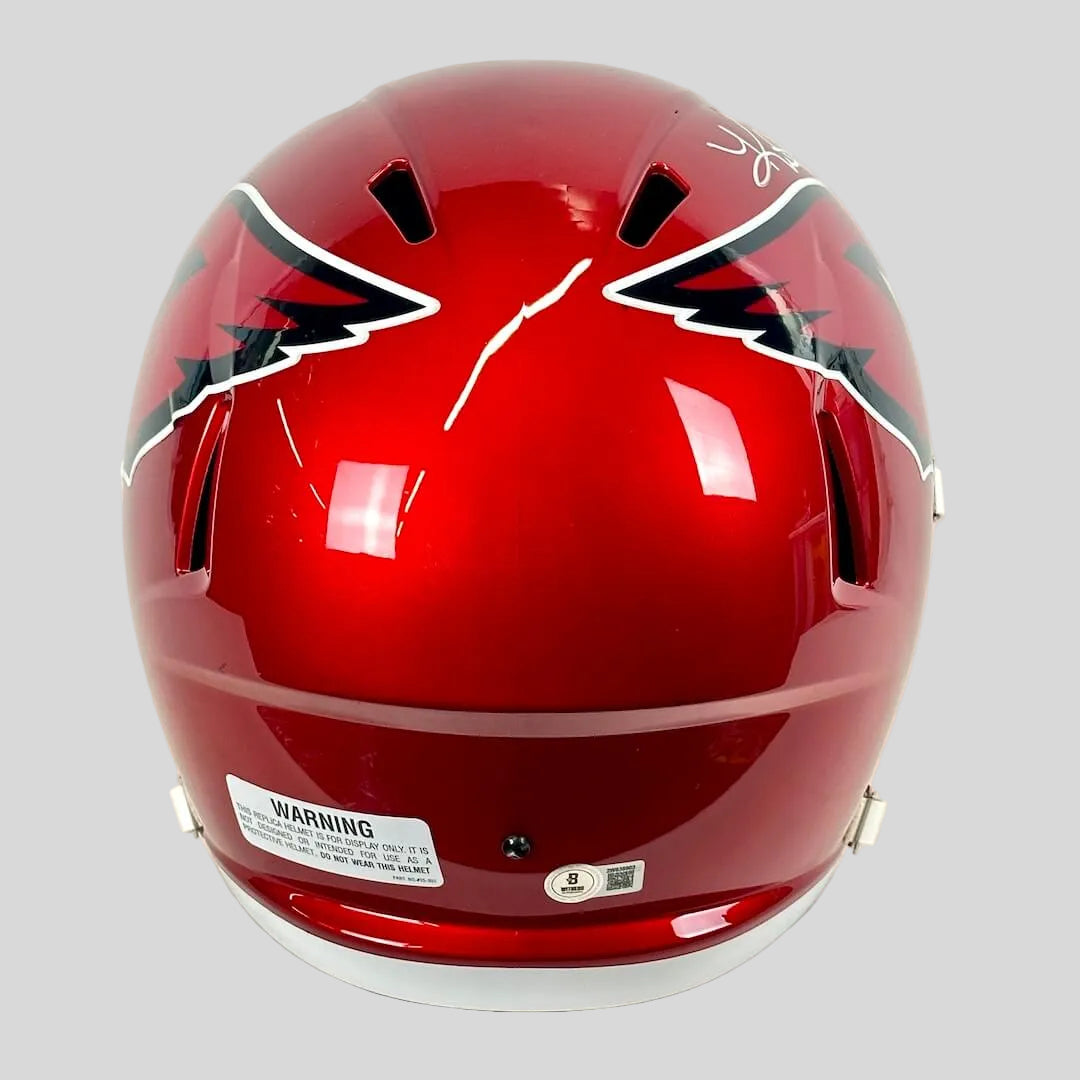 Back view of helmet with warning and authentication stickers. 