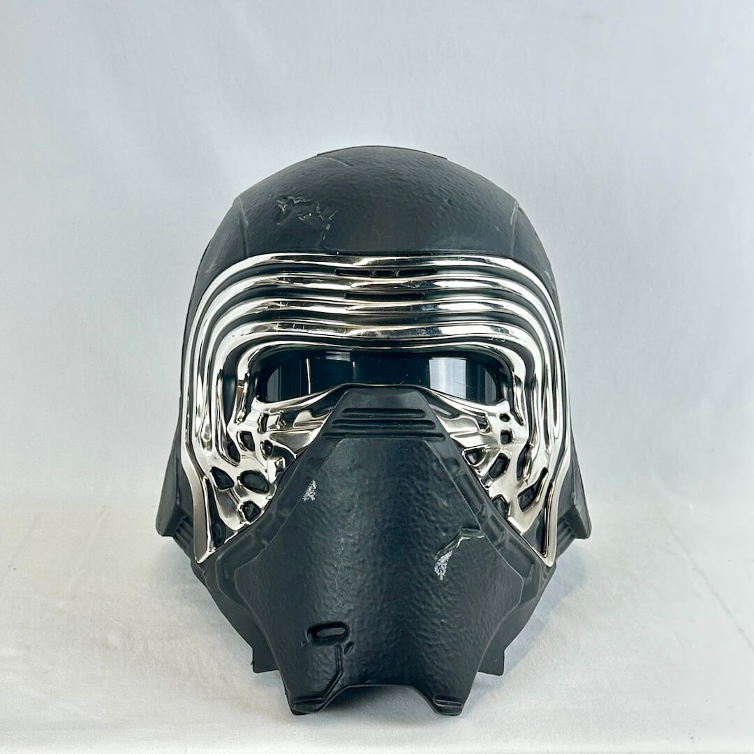 A black and chrome Kylo Ren-style helmet mask photographed against a plain light gray background.