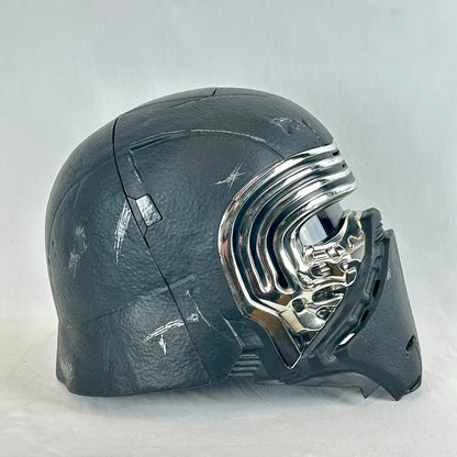 A black textured sci-fi helmet with a shiny chrome visor and mouthpiece, shown from a side profile.