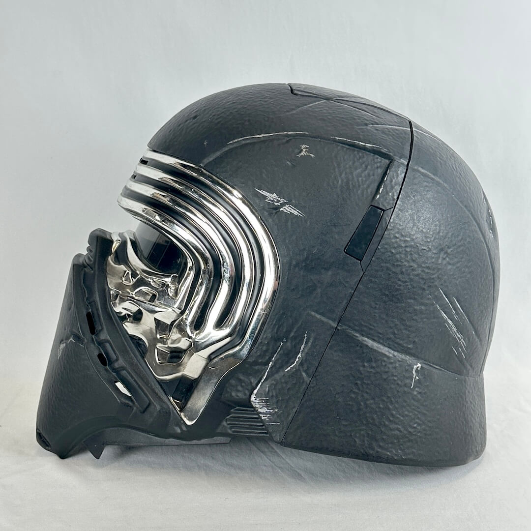 A black textured helmet from Star Wars, featuring a shiny chrome visor and a black face mask.