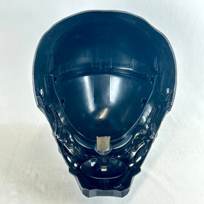 A black plastic full-face helmet shell, photographed from above against a plain off-white background.