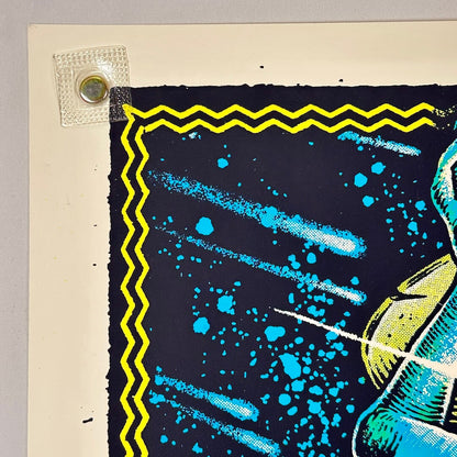 Top left corner of poster with sharp point and clean edges. 