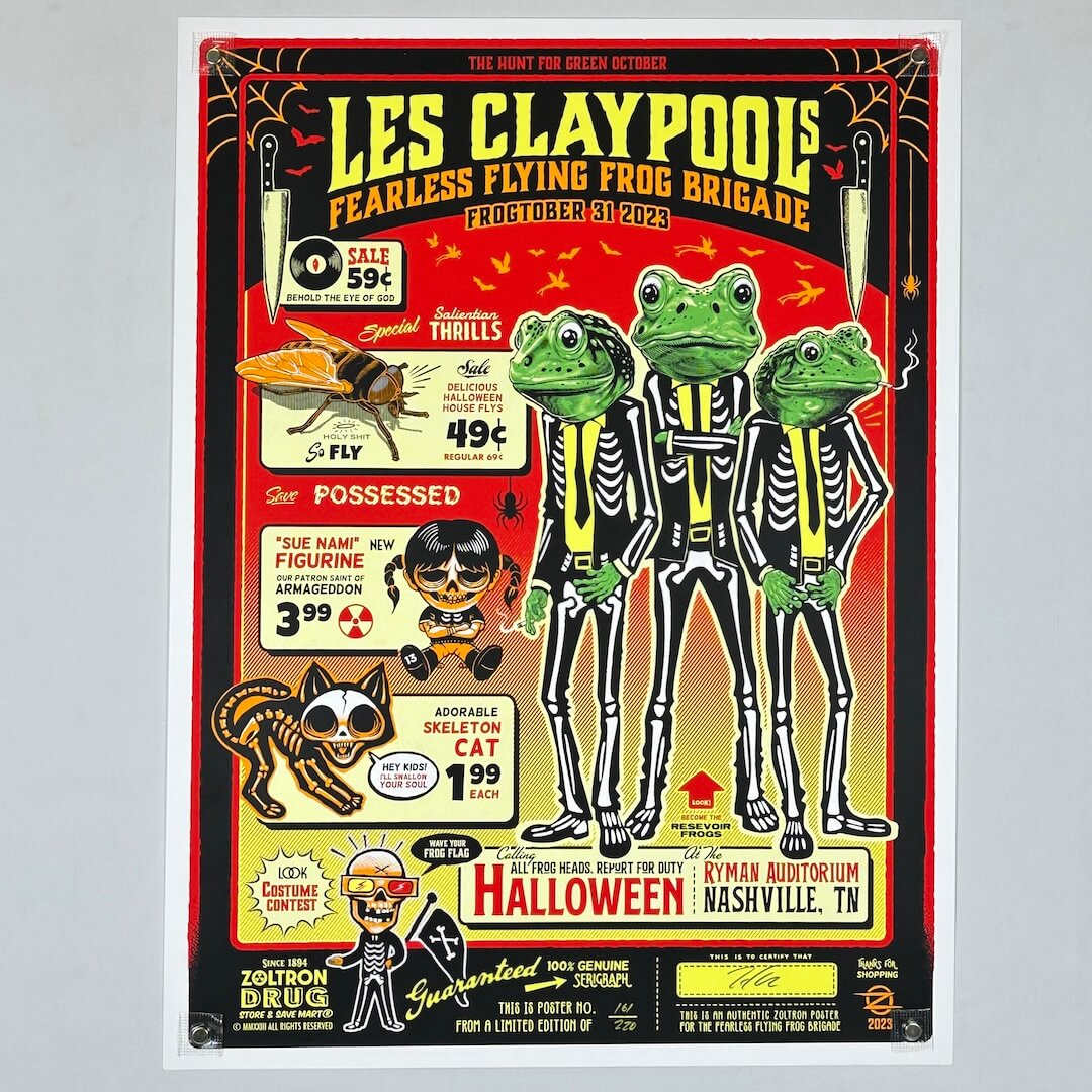 Promotional poster for Les Claypool's Fearless Flying Frog Brigade with frogs in skeleton costumes on a red background.