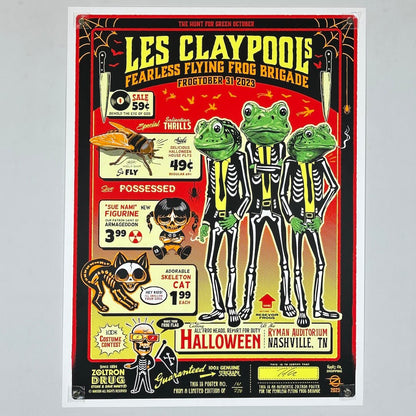 Promotional poster for Les Claypool's Fearless Flying Frog Brigade with frogs in skeleton costumes on a red background.