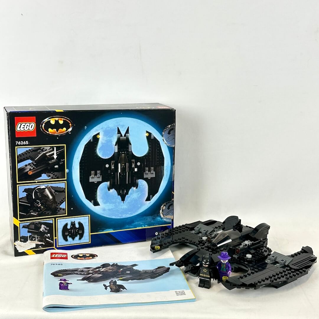 LEGO Batman Batmobile set with packaging and instructions on a white background