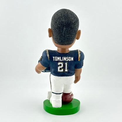 Bobblehead figure of a football player in a blue jersey with 'Tomlinson 21' on a white background