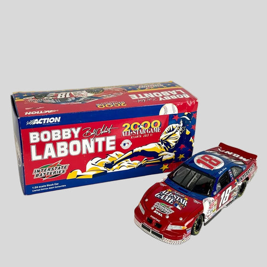 A diecast race car next to its original packaging box, and is red and blue with 'BOBBY LABONTE 2000 ALL-STAR GAME' 