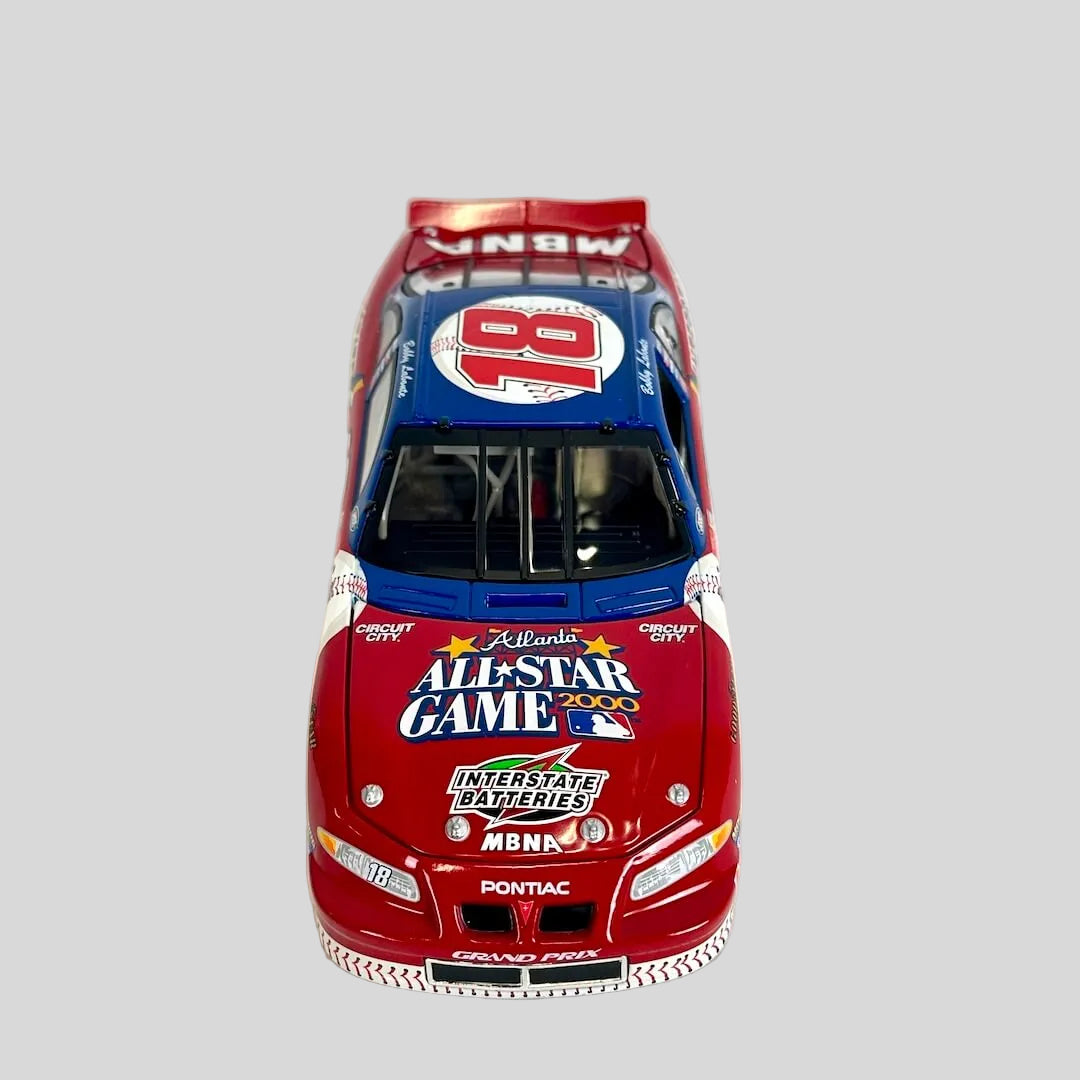 A die-cast model of a red and blue Pontiac race car with 'All-Star Game' and 'MBNA' sponsor decals.