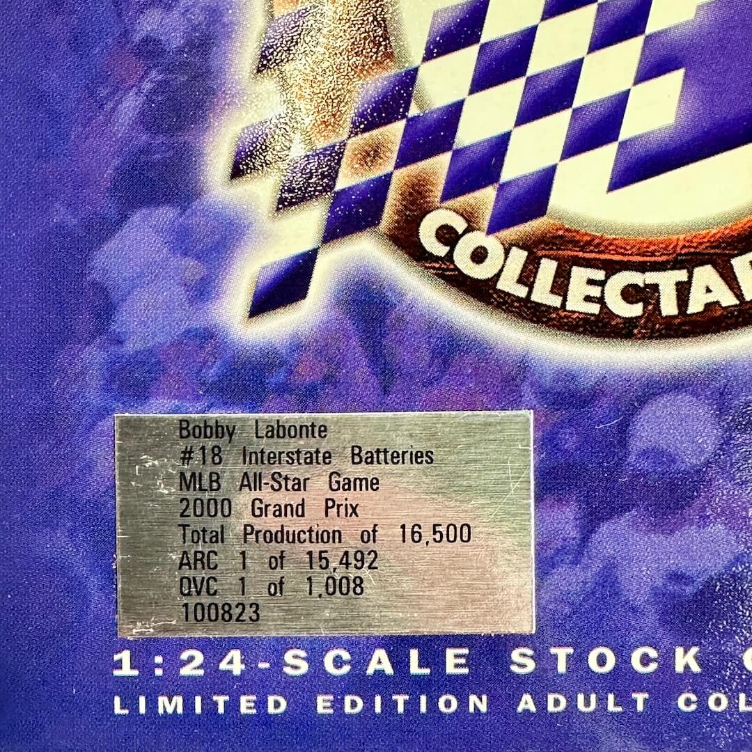 A close-up of a collectible 1:24 scale model car sticker with Bobby Labonte's MLB All-Star Game car statistics.