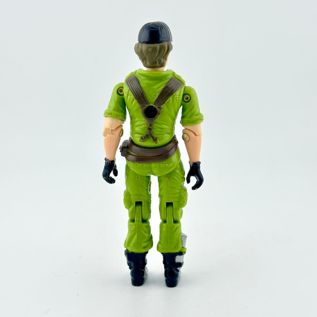 Female GI Joe action figure in green military uniform with brown and black accents, pictured on white background. 