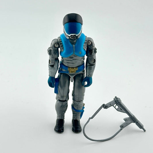 Action figure in a blue and gray suit with a weapon on a white background