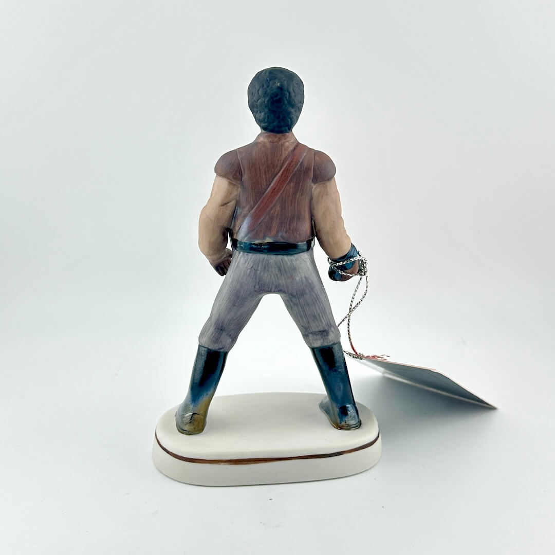 Star Wars Figurine with red tag against white background.