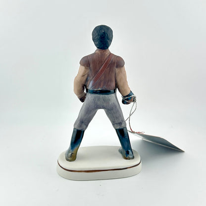 Star Wars Figurine with red tag against white background.