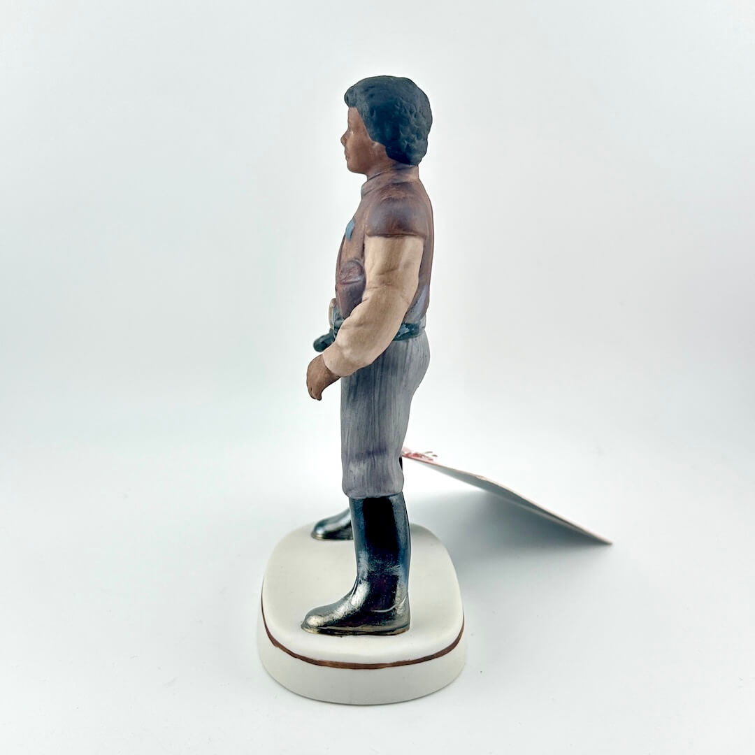 Star Wars Figurine with red tag against white background.