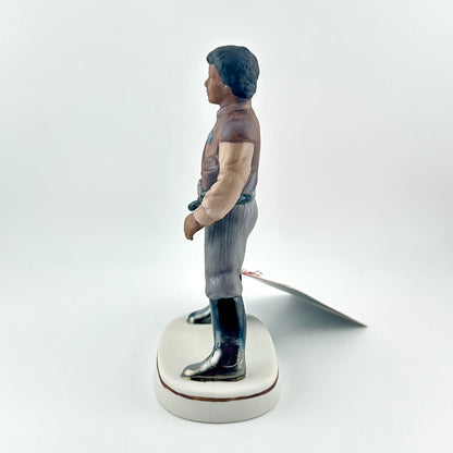 Star Wars Figurine with red tag against white background.