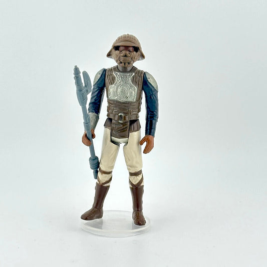 Action figure of Lando in Skiff Guard outfit from Star Wars franchise on a white background