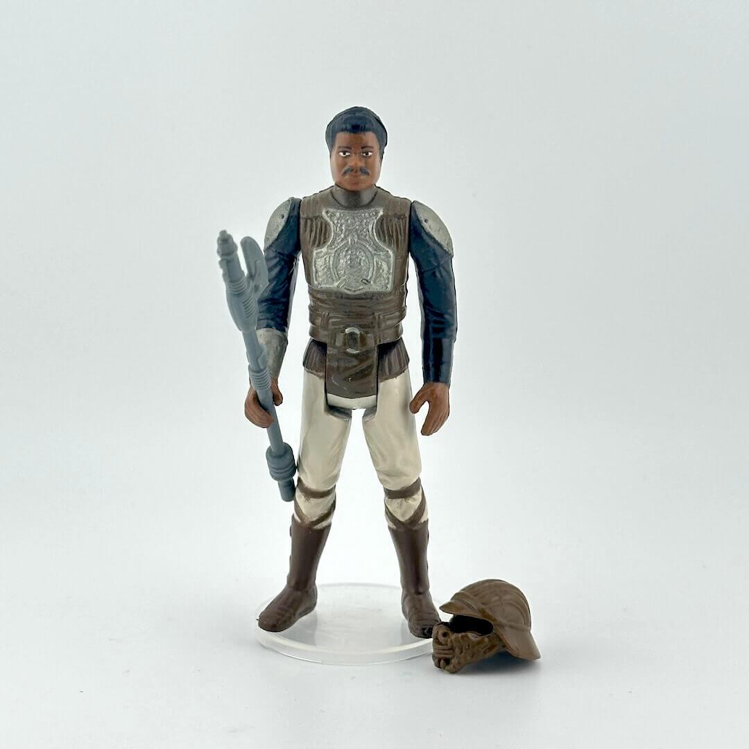 Action figure of Lando in Skiff Guard outfit from Star Wars franchise on a white background