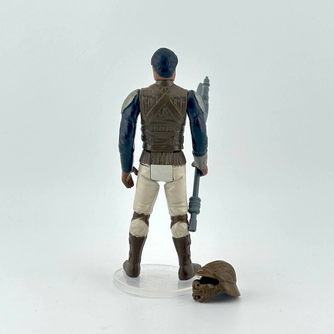 Action figure of Lando in Skiff Guard outfit from Star Wars franchise on a white background