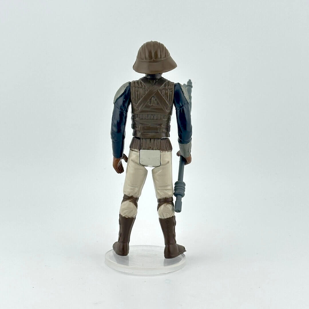 Action figure of Lando in Skiff Guard outfit from Star Wars franchise on a white background
