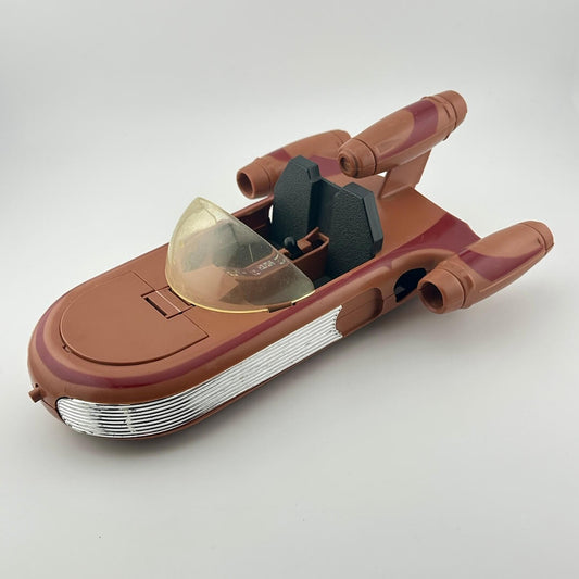Toy spaceship model on a white background