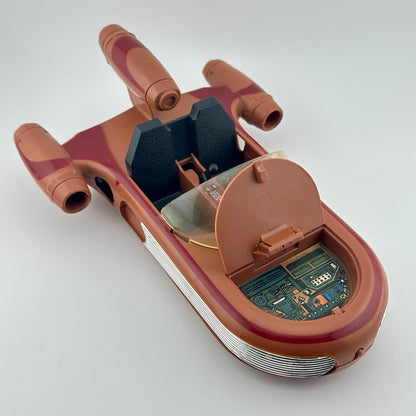 Toy spaceship model on a white background