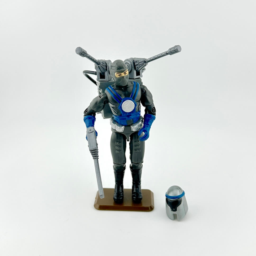 Toy figure with accessories against white background. 