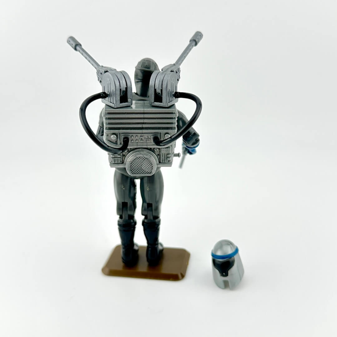 Toy figure with accessories against white background. 