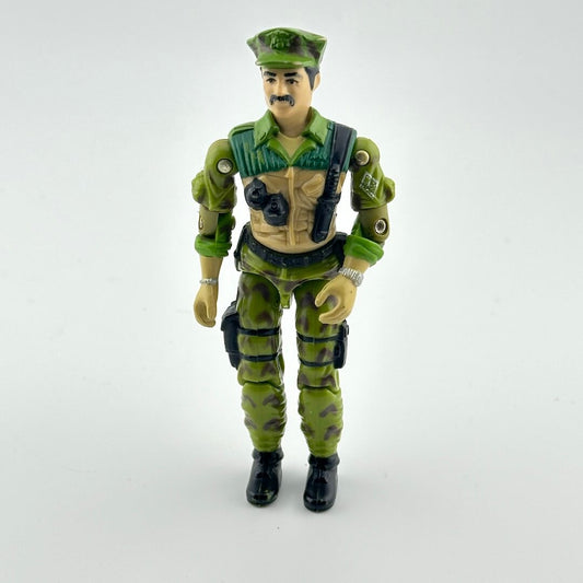 Toy figure in green military uniform with helmet on a white background