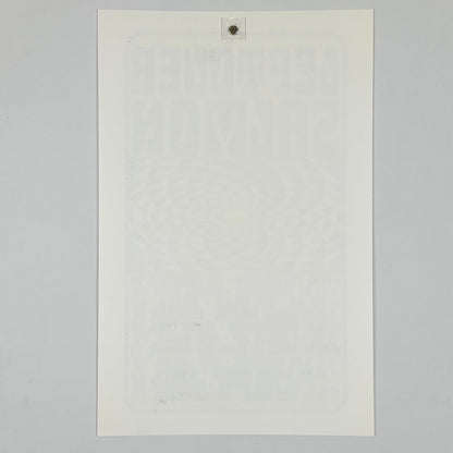 Backside of white poster against white background. 