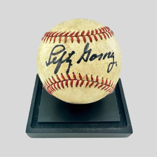 Black base with browned baseball signed with black felt marker in sweet spot, Lefty Gomez. 