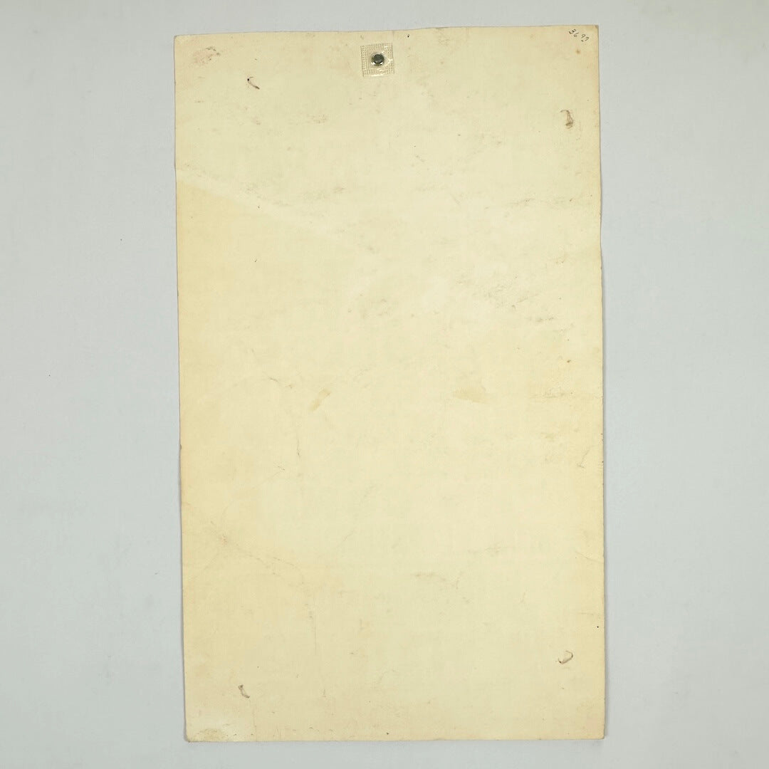 Backside of poster to show discoloration against white background. 