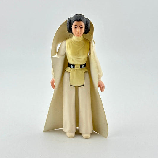 Toy figure of a character in a long beige robe on a white background