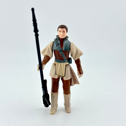 Action figure in a costume holding a weapon on a light gray background