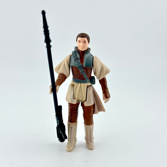 Action figure in a costume holding a weapon on a light gray background