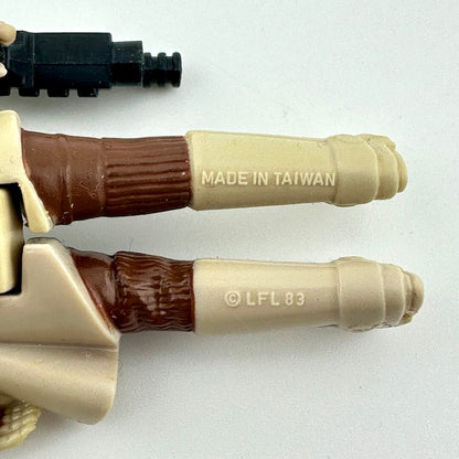 Close-up of back of Leia's legs showing the COO and copyright information embossed into leg. 