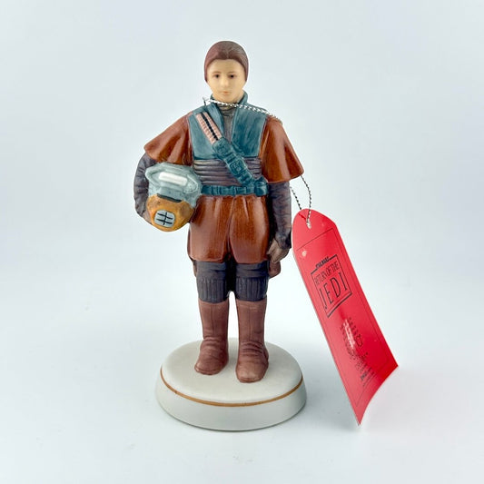 Star Wars figurine with red tag against white background. 