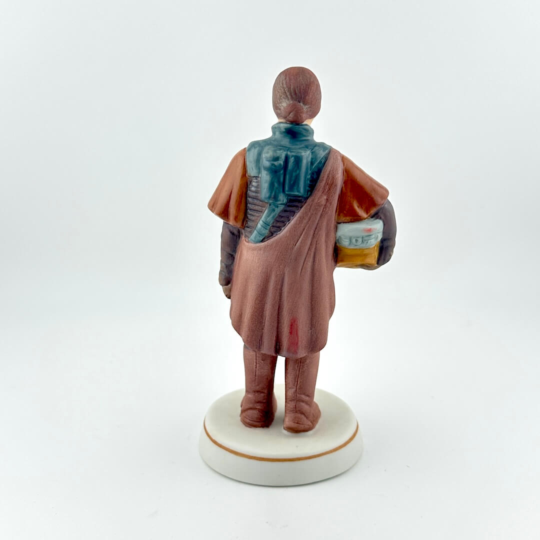 Star Wars figurine with red tag against white background. 