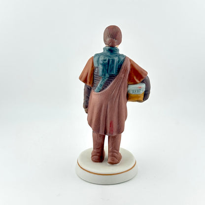 Star Wars figurine with red tag against white background. 