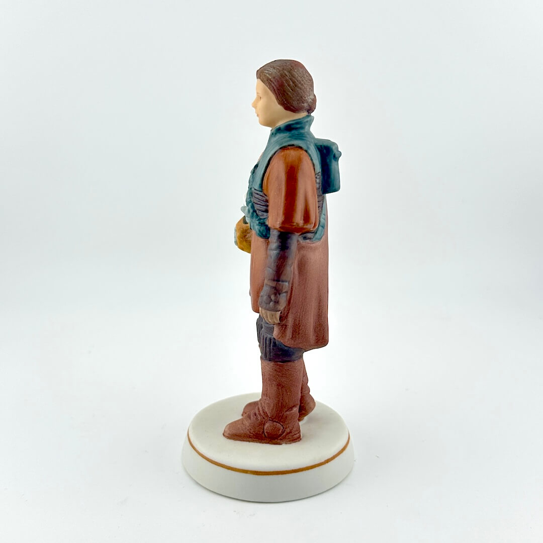 Star Wars figurine with red tag against white background. 