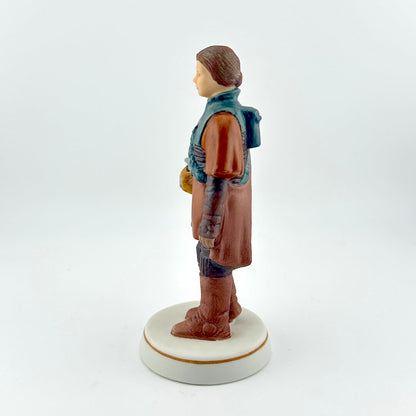 Star Wars figurine with red tag against white background. 